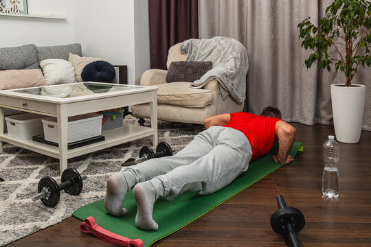 Home workout session with push-ups in living room