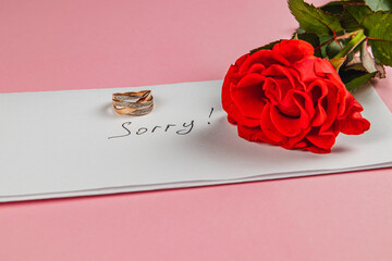 Broken engagement with a rose and a heartfelt apology note presented
