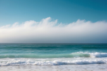 Obraz premium White Fog Bank Rolling Across a Teal Ocean Horizon