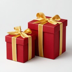 Obraz premium Two red gift boxes with gold ribbons