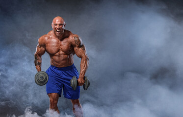 Action Shot of Huge Muscular Man, Bodybuilder Screaming at Camera, holding Weights, surrounded by Smoke