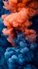 Obraz premium Abstract swirling colors of vibrant orange and blue inks