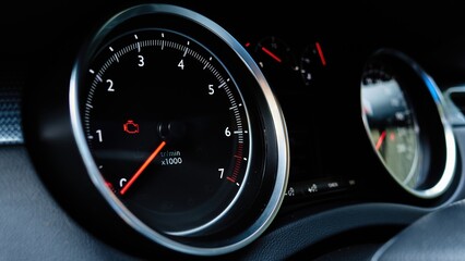 Car tachometer with check engine warning light illuminated