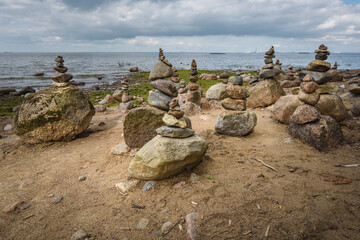 Rock pyramids on the seashore in a public park.