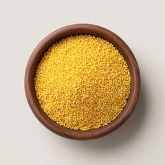 Raw organic millet grains in wooden bowl