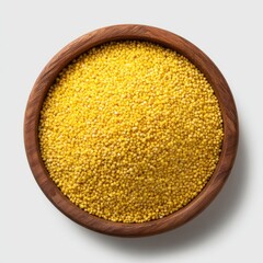 Raw organic millet grains in wooden bowl