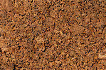 Close-up with shallow depth of field. Surface of pressed cork wood. Orange warm background