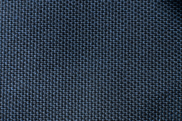 Close-up texture of textile surface. Extreme macro close-up of synthetic fabric surface