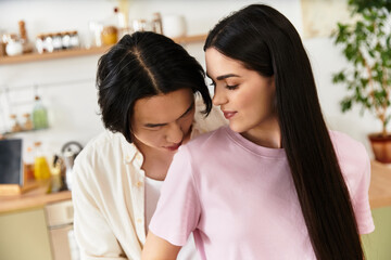 Loving couple shares a tender moment in their cozy kitchen at home during a quiet evening