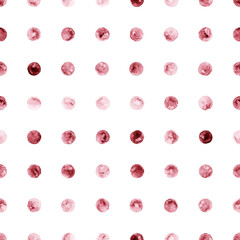 Seamless watercolor polka dot pattern in red and maroon colors on white background. Ideal for textile, wrapping paper, and decor. Hand drawing.