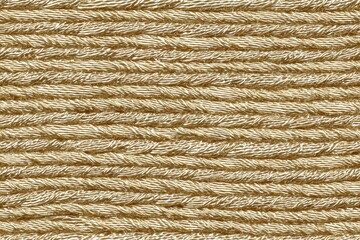 Seamless twisted natural Satin fibers rope, showcasing its texture and pattern. The strands are tightly woven, creating a uniform and sturdy appearance, ideal for nautical or rustic themes.