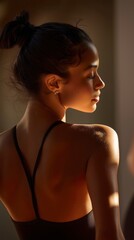 Dancer glowing back in golden afternoon light