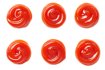 Six swirls of ketchup isolated on a white background