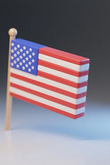 Minimalist 3D USA Flag Illustration 
 A modern 3D illustration of the United States flag with a minimalist block-style design. The flag appears to be made of thick red, white, and blue segments, set 