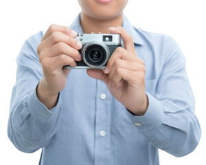 Fototapeta premium Person holding vintage camera, ready to take photograph, wearing light blue shirt. expression conveys excitement and anticipation for capturing moment