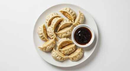 Overhead Shot of Delicious Pan-Fried Dumplings with Dipping Sauce