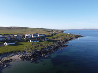 Port Charlotte is a town on the west coast of Islay, Scotland. Whisky distilleries and hotels dot the area, with scenic shorelines and historic charm.