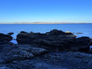 Port Charlotte is a town on the west coast of Islay, Scotland. Whisky distilleries and hotels dot the area, with scenic shorelines and historic charm.