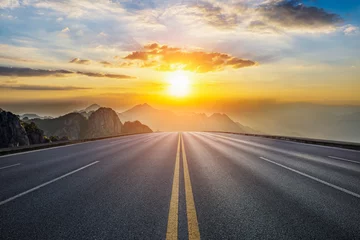 Fotobehang Empty asphalt highway and mountain with beautiful sky clouds at sunset © ABCDstock