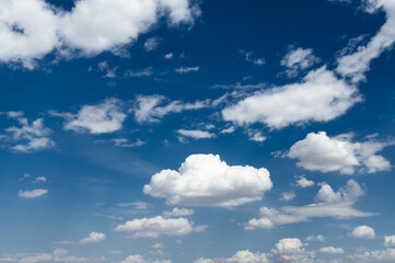 Beautiful white clouds in a blue sky background. Cotton clouds in blue sky. Natural view of clouds. Meteorology and environment concept background. Cumulus clouds background. Cotton cloud in summer. 