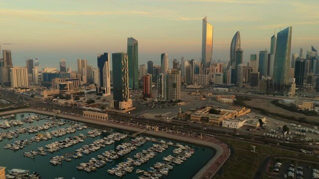 Golden Hour Aerial View of Kuwait City Skyline and Marina &ndash; 4K Drone Footage