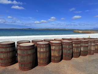 Fototapeta premium Islay whisky is a single malt produced on Scotland’s Islay island featuring strong peaty smoky flavor. Seaweed iodine salty notes create a complex robust taste popular with enthusiasts.