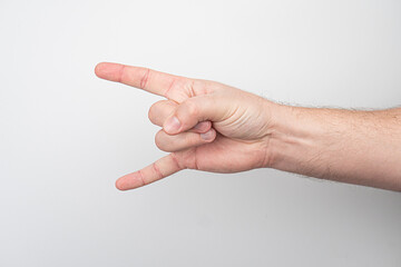 Close-up of extended index and middle fingers against a gradient background, transitioning from white to light gray.