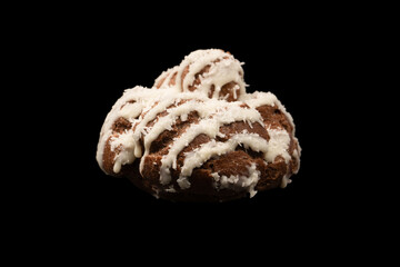 Profiteroles with coconut cream on a black background.