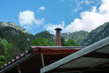 Rustic chimney with Olympus mountain background

