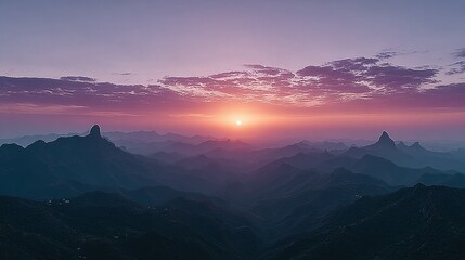 Fototapeta premium Sunrise over a majestic mountain range.