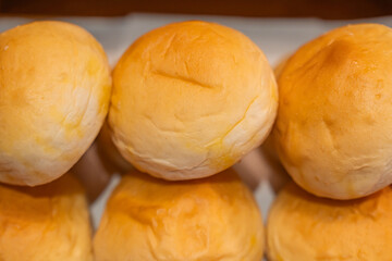 Assortment of freshly baked breads, beautifully arranged and ready to enjoy.