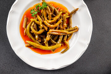 Green beans tomato sauce fresh delicious gourmet food background on the table rustic food top view copy space keto and paleo diet vegetarian and vegan food