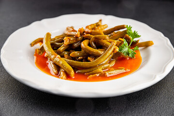 Green beans tomato sauce fresh delicious gourmet food background on the table rustic food top view copy space keto and paleo diet vegetarian and vegan food