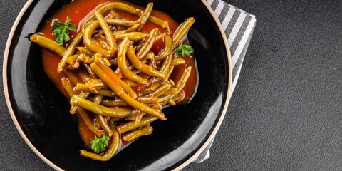 Green beans tomato sauce fresh delicious gourmet food background on the table rustic food top view copy space keto and paleo diet vegetarian and vegan food