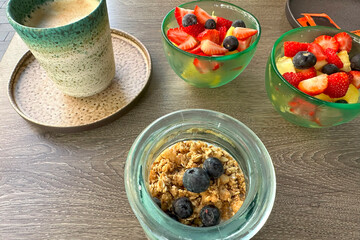 moment of healthy eating and conversation in cafe, Enjoying nutritious bowls of overnight oats and fresh fruit, healthy eating