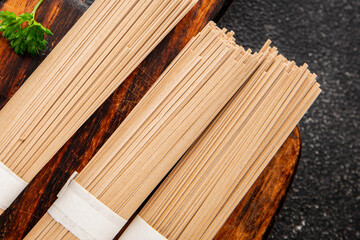 Buckwheat noodles raw soba pasta fresh dish food Asian cuisine on the table rustic food top view copy space