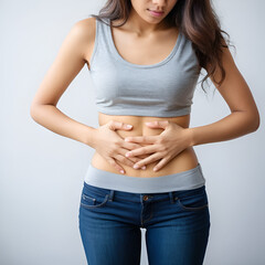 A young woman holding her stomach, abdominal pain, endometriosis, Crohn's disease, SIBO (small intestinal bacterial overgrowth), food intolerance, appendicitis, ulcerative colitis, IBS