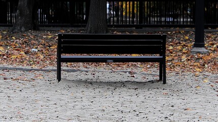 Autumn Park Bench with Sandy Ground.