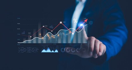 Businessman hand pointing ROI graph, symbolizing smart investment strategies using digital...