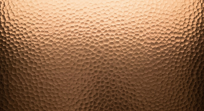 Hammered copper metal surface texture background with warm light