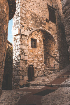 street view in the old town of eza village in cote d'azul, france, on a quiet sunny day
