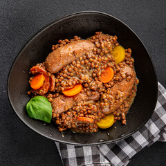 Lentils with sausage, vegetable dish appetizer fresh tasty gourmet food background on the table rustic food top view copy space