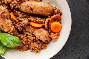 Lentils with sausage, vegetable dish appetizer fresh tasty gourmet food background on the table rustic food top view copy space