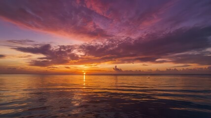 Obraz premium Beautiful ocean sunset with colorful clouds and water reflection stock photo download