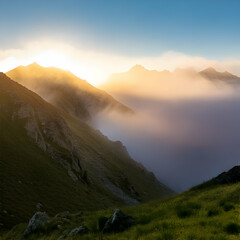 Obraz premium Sunrise Over Foggy Mountain Peaks