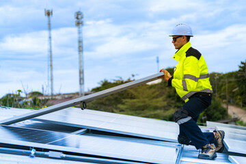 technician lifting a photovoltaic panel during installation, showcasing renewable energy advancement. Dressed in safety gear, reflecting a focus on green energy solutions and sustainable development.