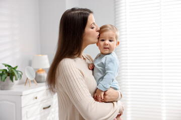 Mother with her cute little baby at home