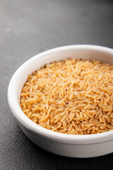 Brown rice cereal whole grain healthy product superfood fresh tasty food background on the table rustic food top view copy space
