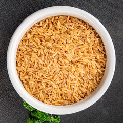 Brown rice cereal whole grain healthy product superfood fresh tasty food background on the table rustic food top view copy space