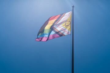 A Pride Flag against Clear Blue Sky